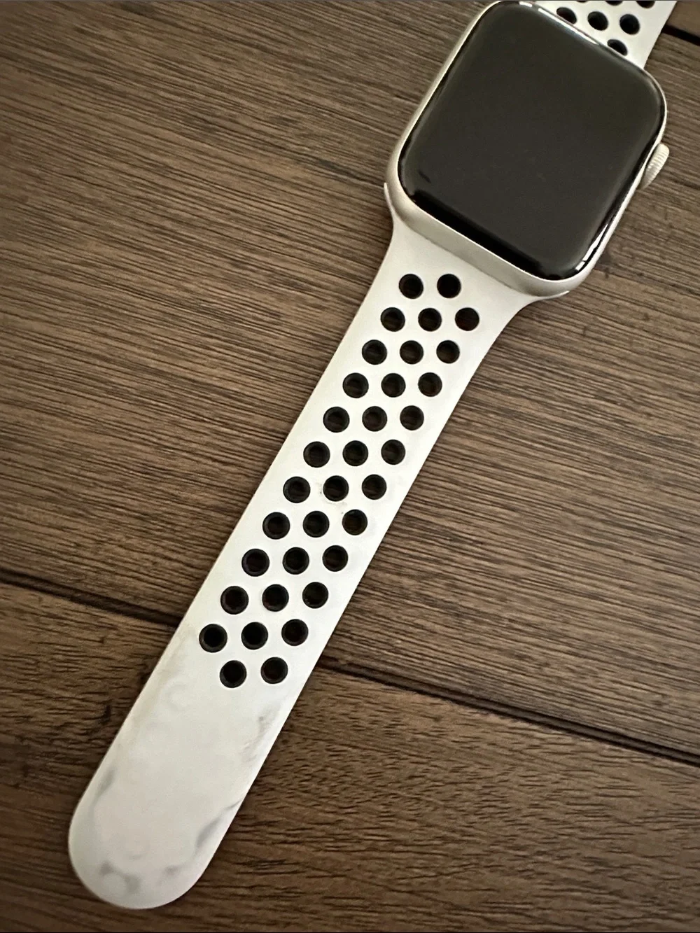 Apple Watch with White Perforated Sport Band. Nike addition series 5